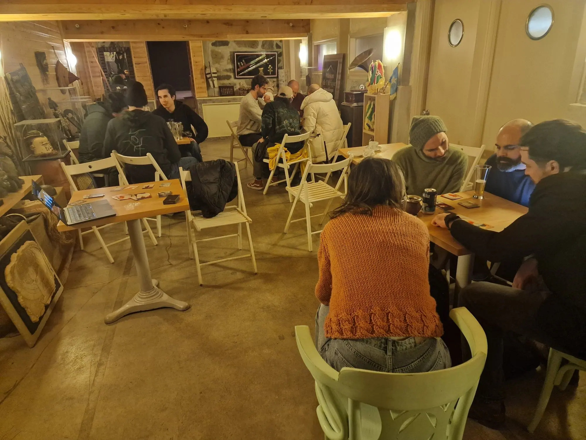 Groups play with the deck around café tables in Montreal.