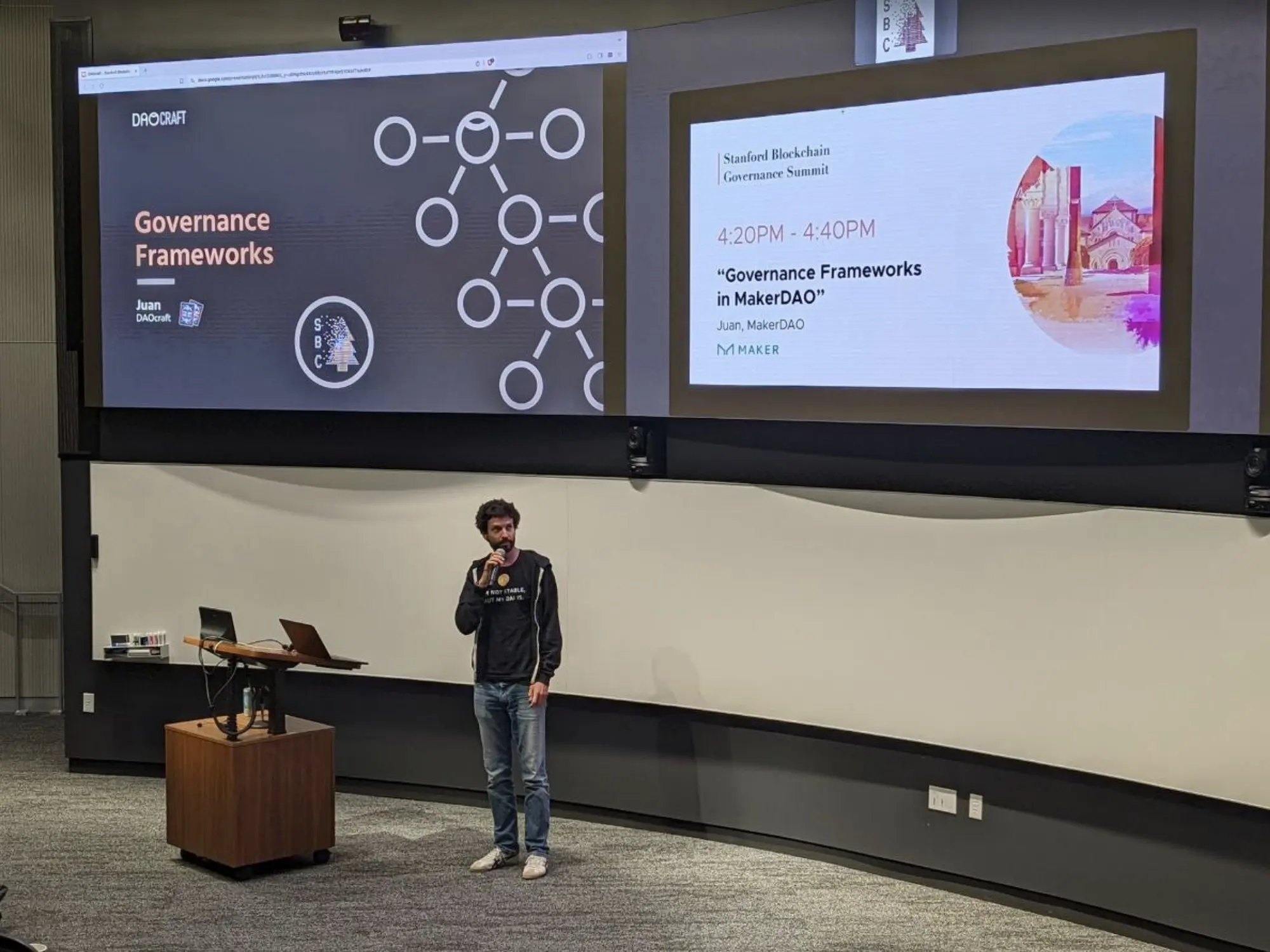 A talk on governance frameworks on stage at the Stanford Blockchain Governance Summit.